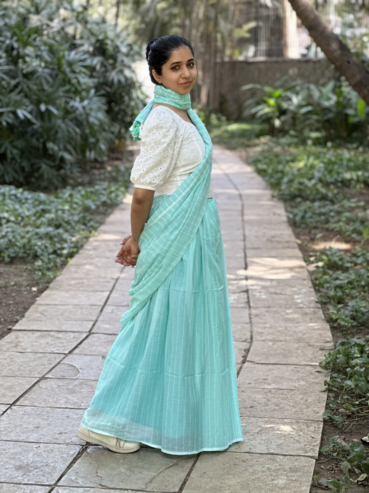 Light blue mul cotton saree with subtle white stripes.
