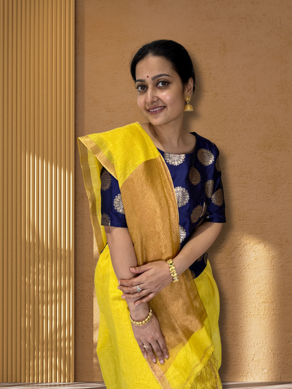 Yellow with zari detailing tissue linen handloom saree