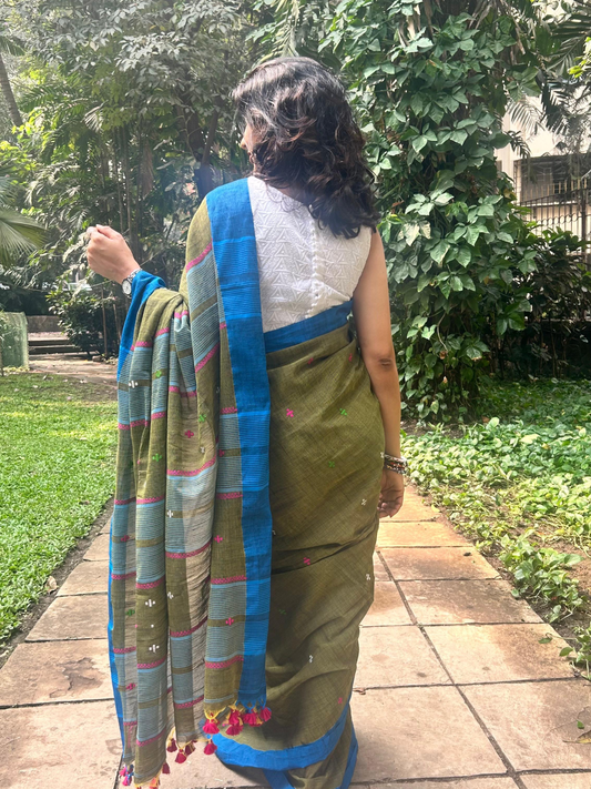 Green handwoven khadi cotton saree with contrast blue border.