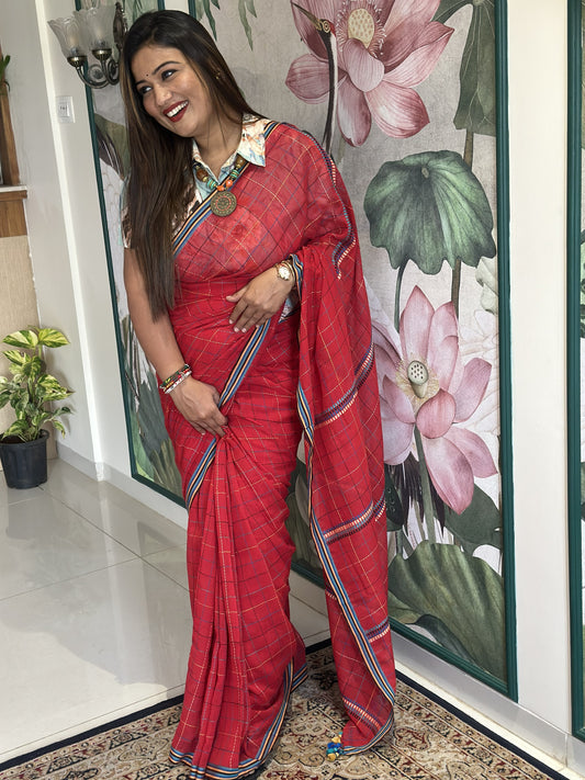 Red mercerized cotton saree with all-over Kantha stitch.