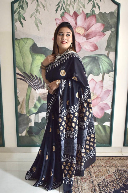 Black mul cotton saree with mustard floral handblock Bagru print.