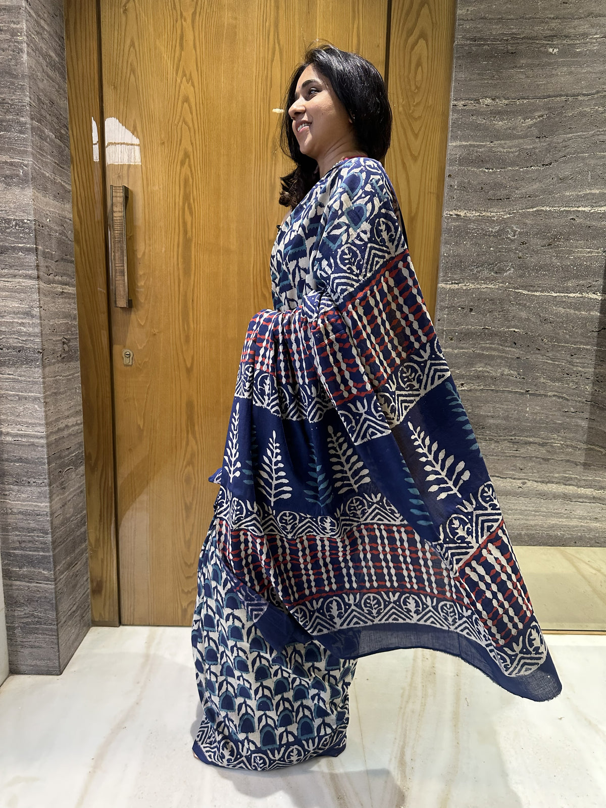Indigo mul cotton saree with white floral handblock Bagru print.