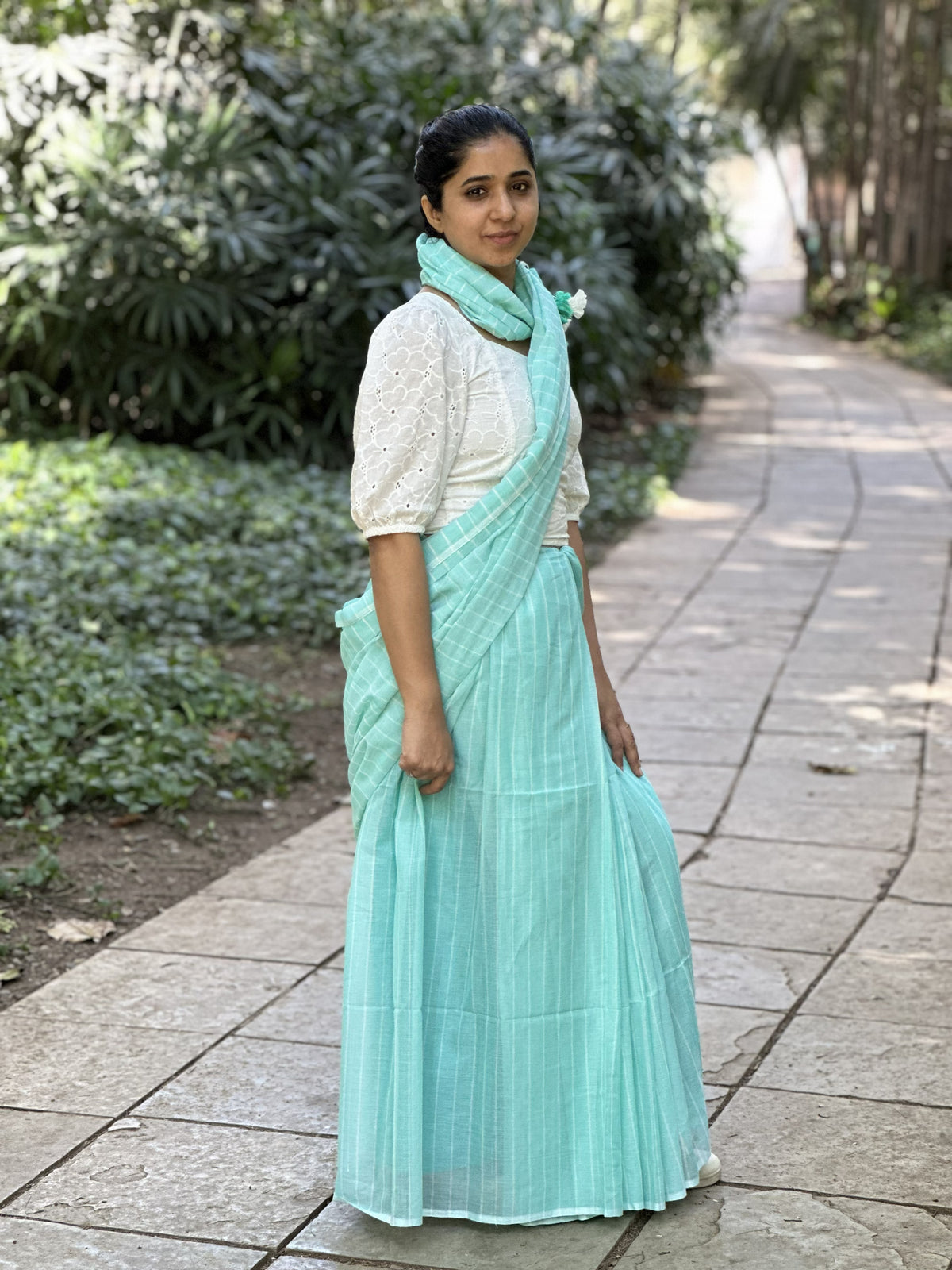 Light blue mul cotton saree with subtle white stripes.