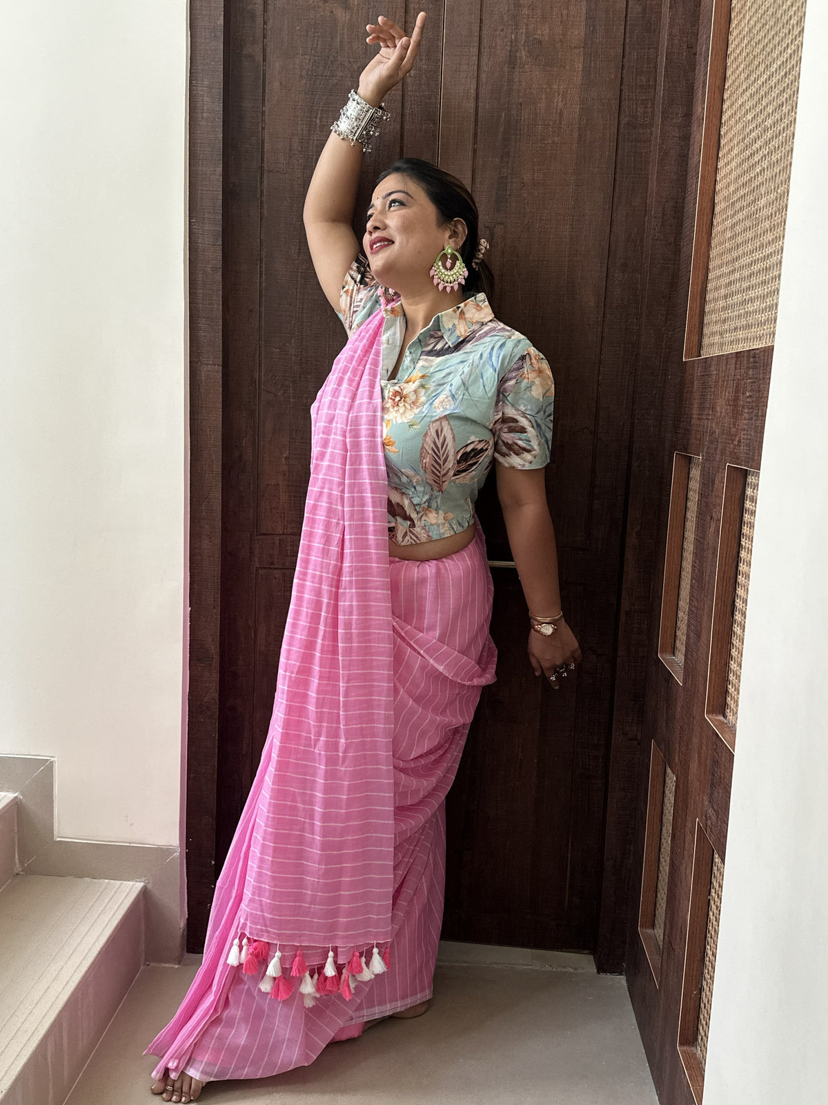 Light pink mul cotton saree with subtle white stripes.