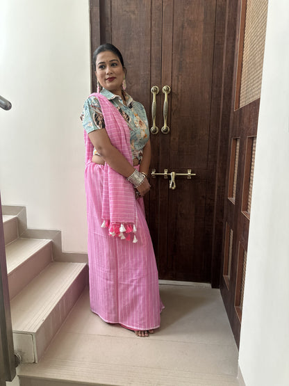 Light pink mul cotton saree with subtle white stripes.