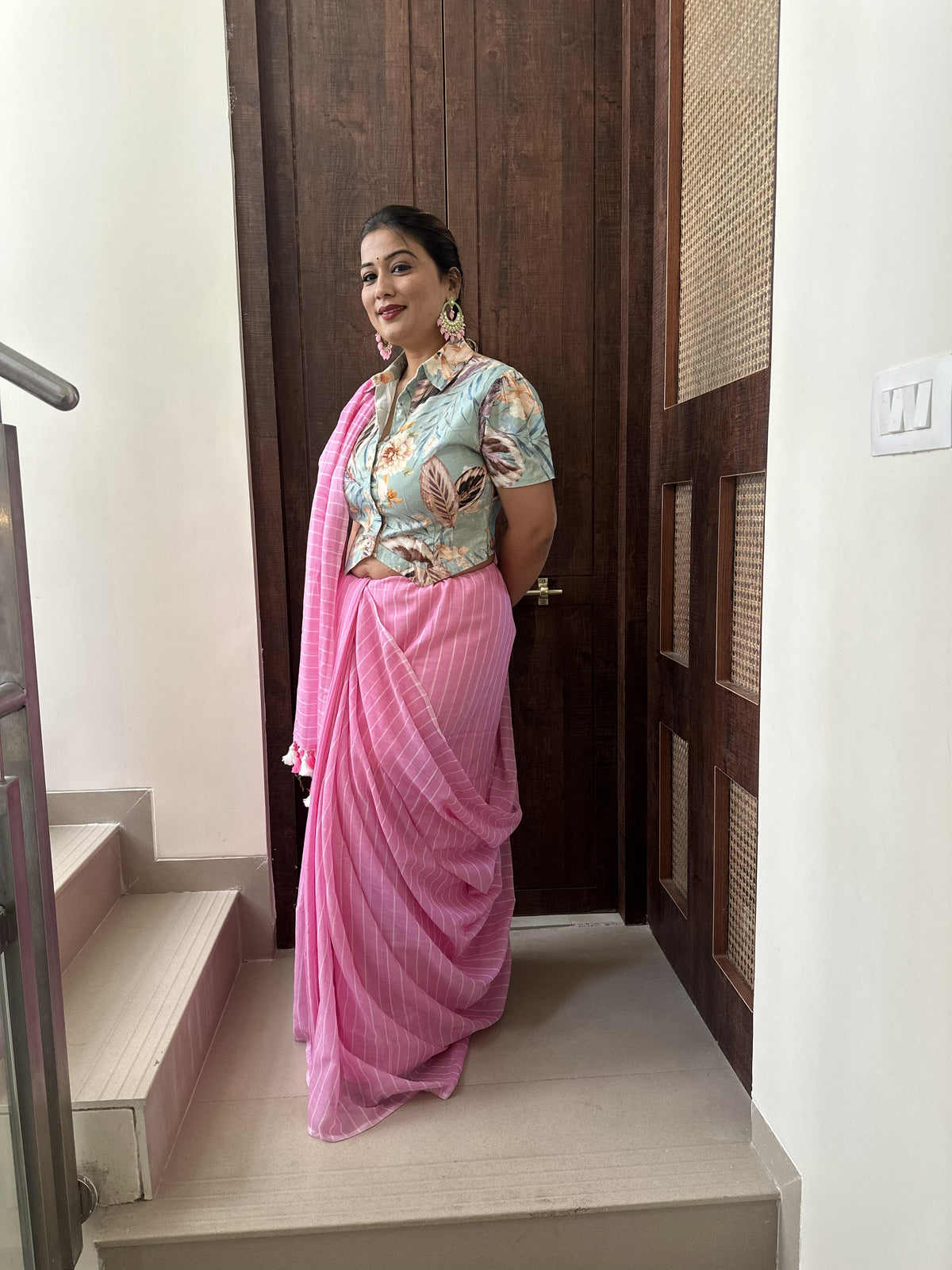 Light pink mul cotton saree with subtle white stripes.