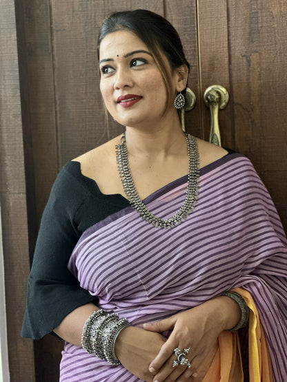 Purple and peach half-and-half mul cotton saree with stripe detailing.