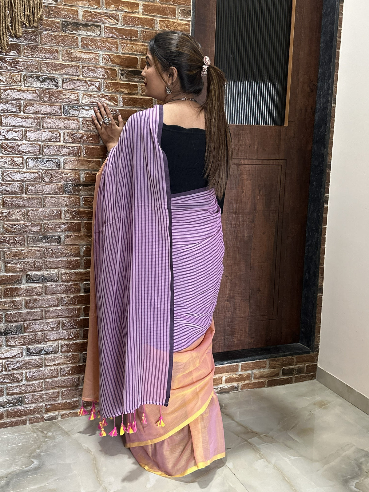 Purple and peach half-and-half mul cotton saree with stripe detailing.
