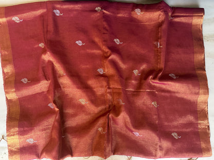 Red tissue linen handloom saree with elegant lotus and leaf motifs.