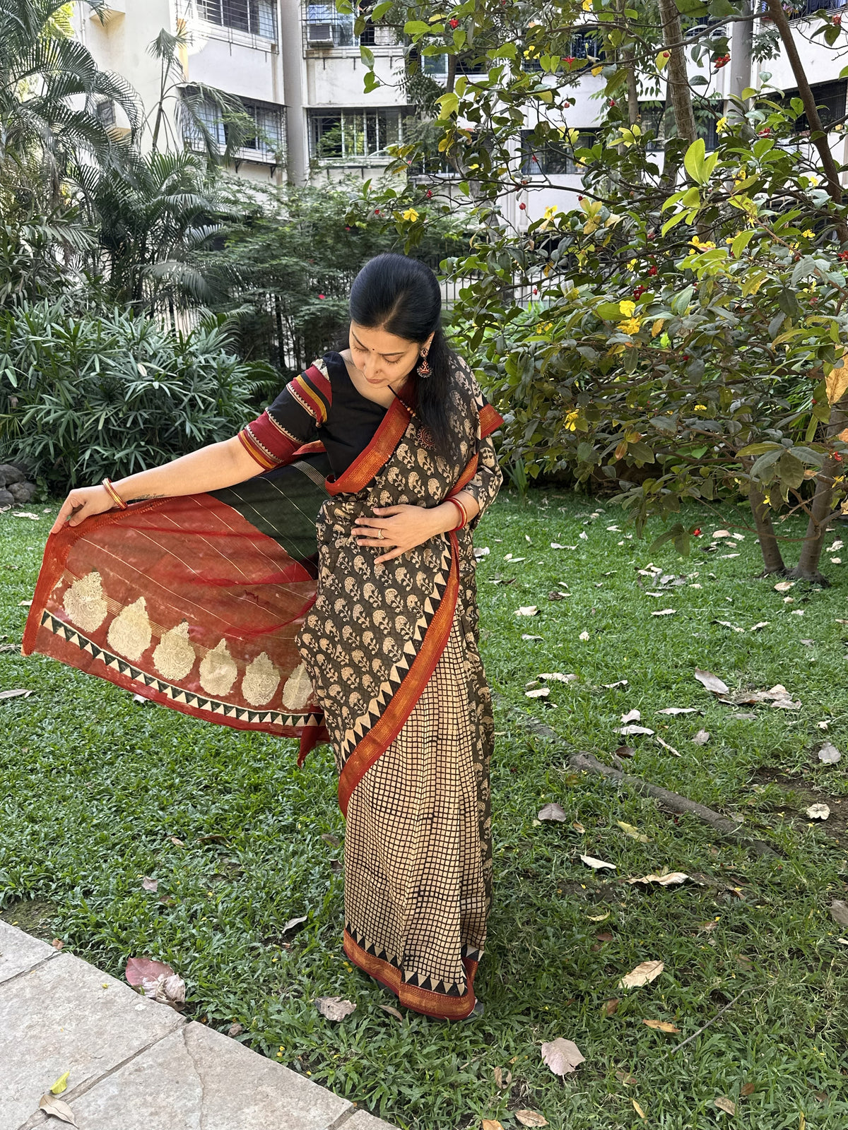 Black and beige Maheshwari cotton silk saree with red pallu