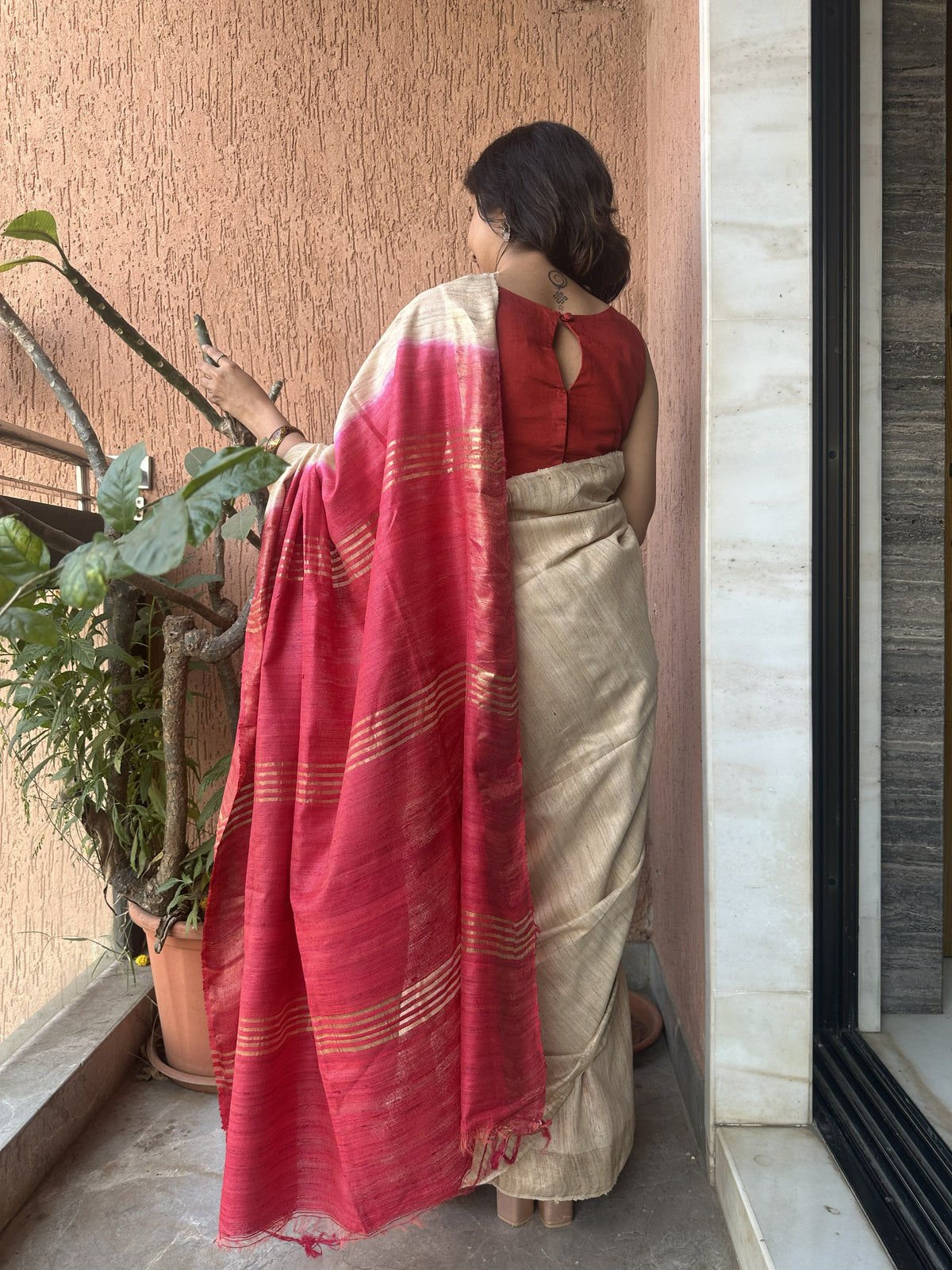 Off-white tussar Ghicha saree with zari border and maroon pallu